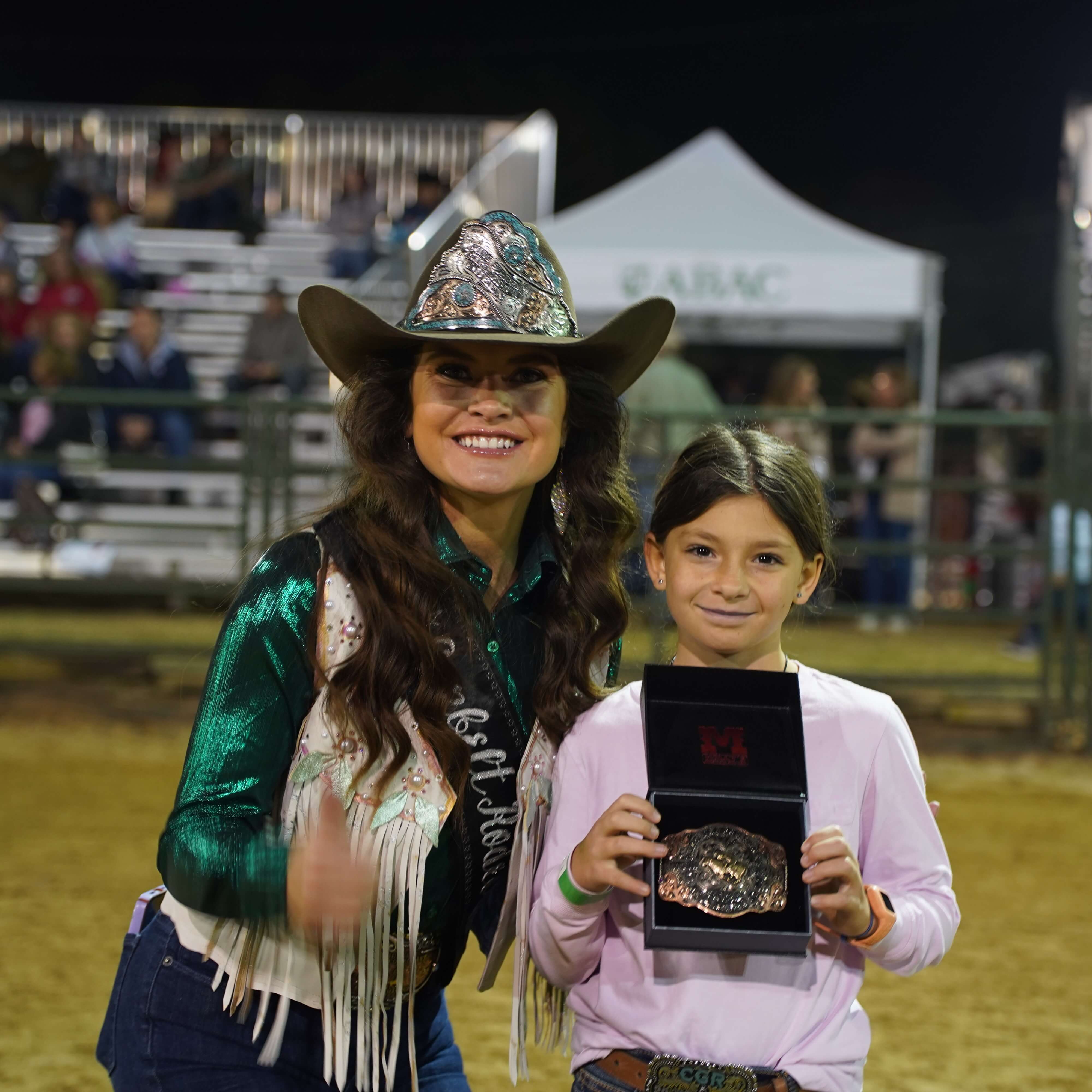 person riding a horse at a rodeo