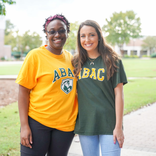 2 female abac students smiling