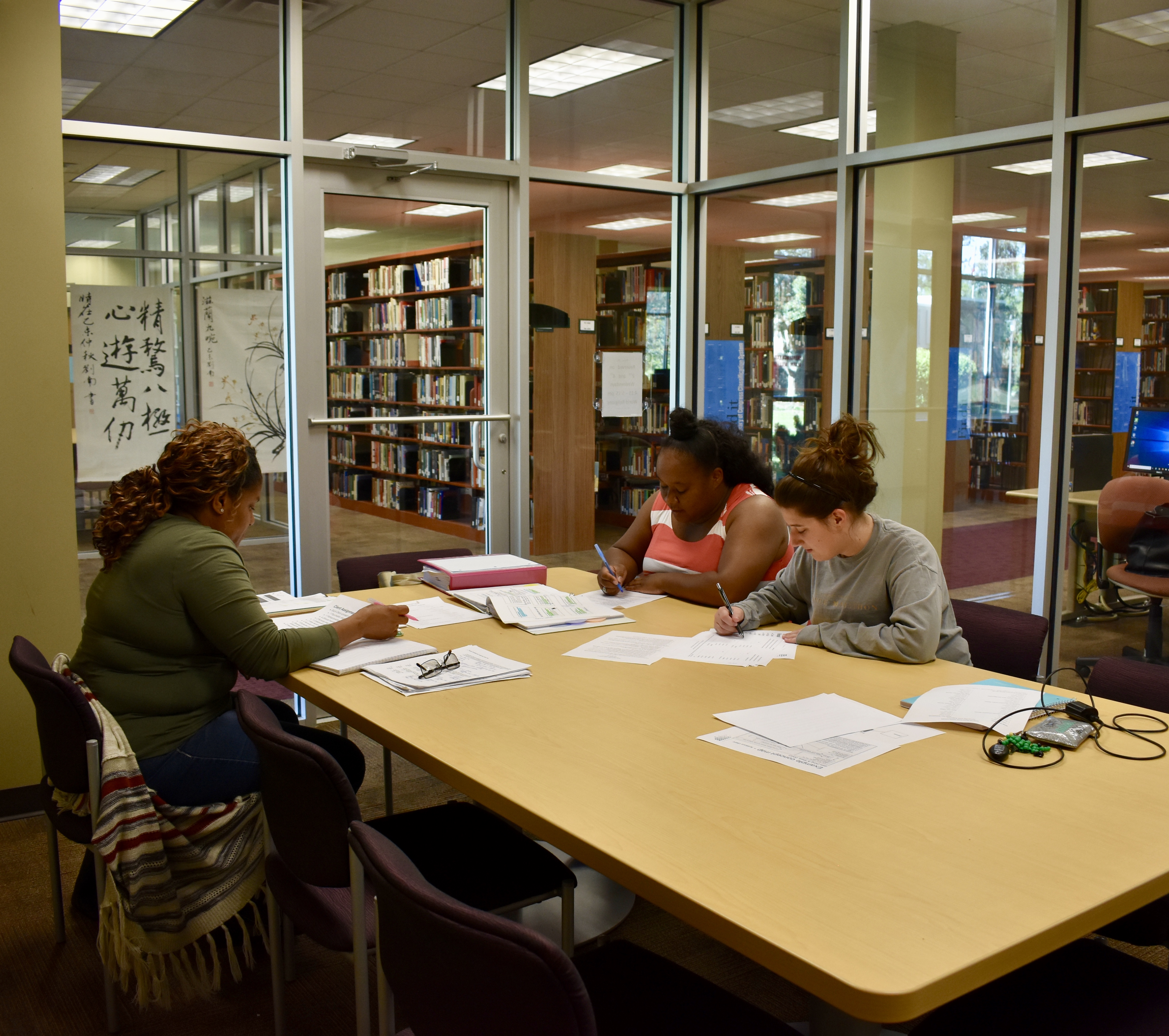 students in a study room in the library