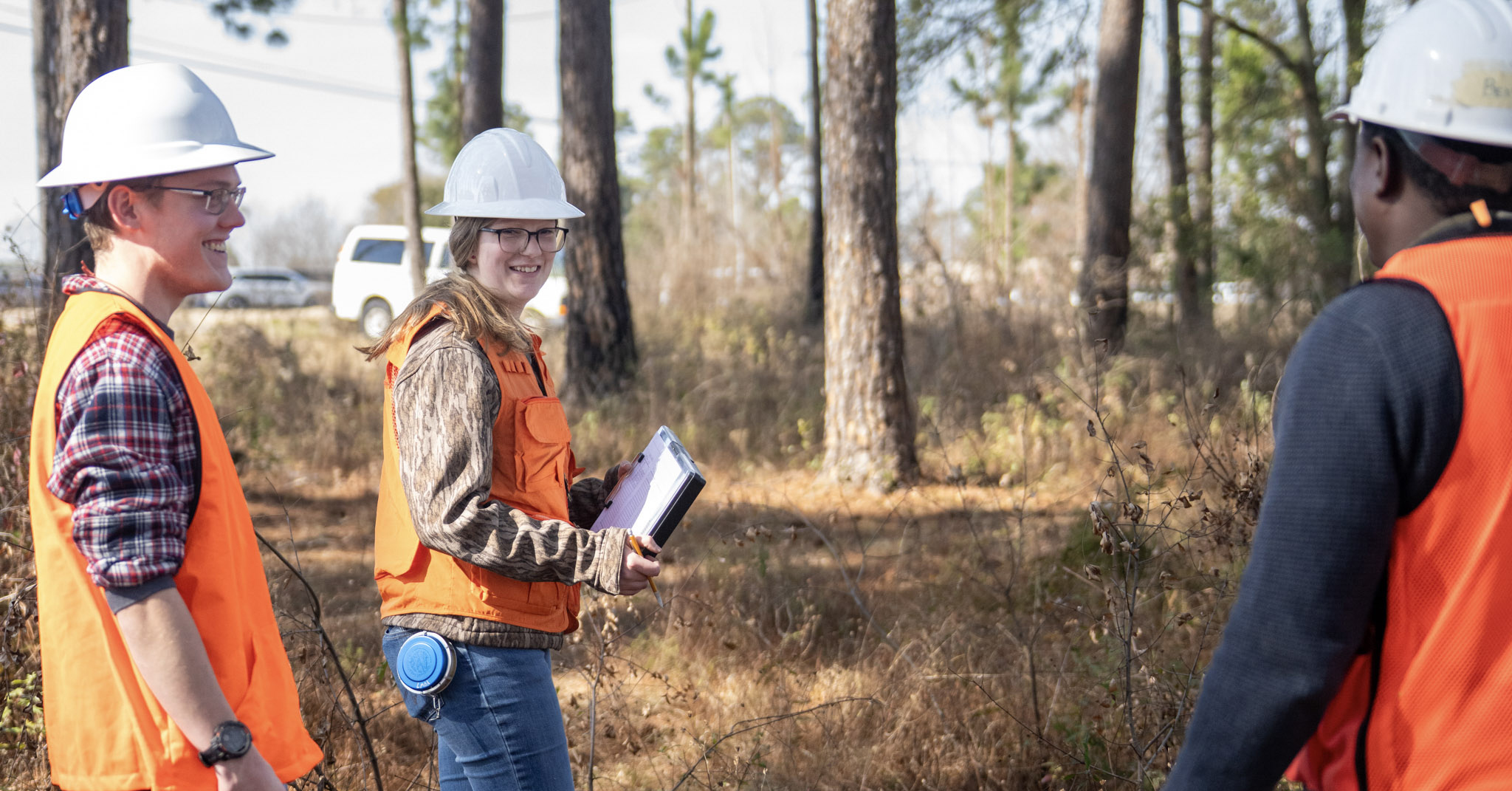 forestry students in an outdoor learning lab in the woods