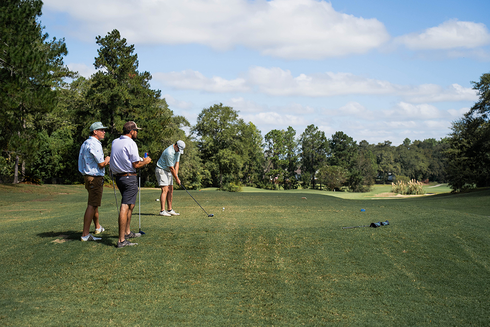 golfers at a tee box