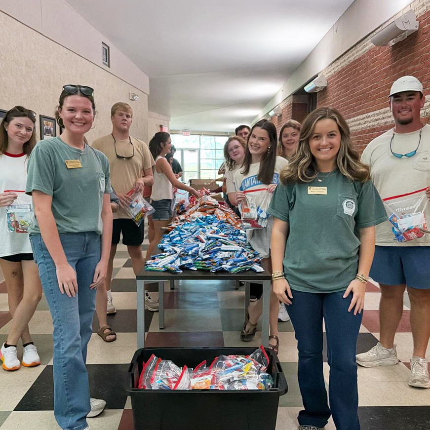 Members of the Agripreneurs packing bags for the Peanut Butter & Jesus program.