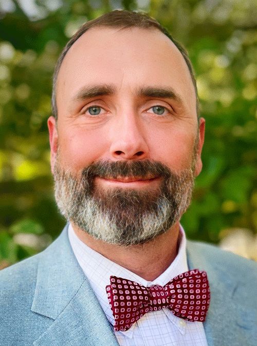 headshot of Raymond Carnley