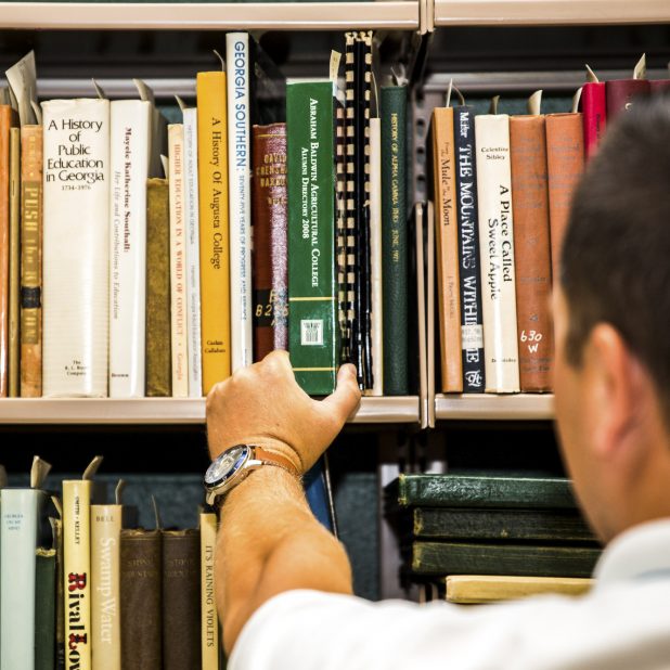 Student choosing book in Library